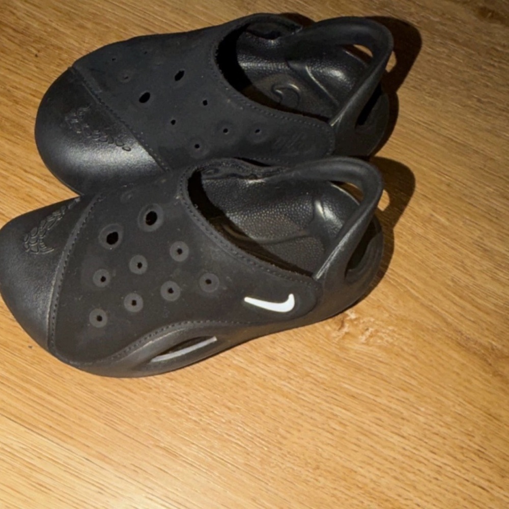 Nike Black Perforated Slip-Ons